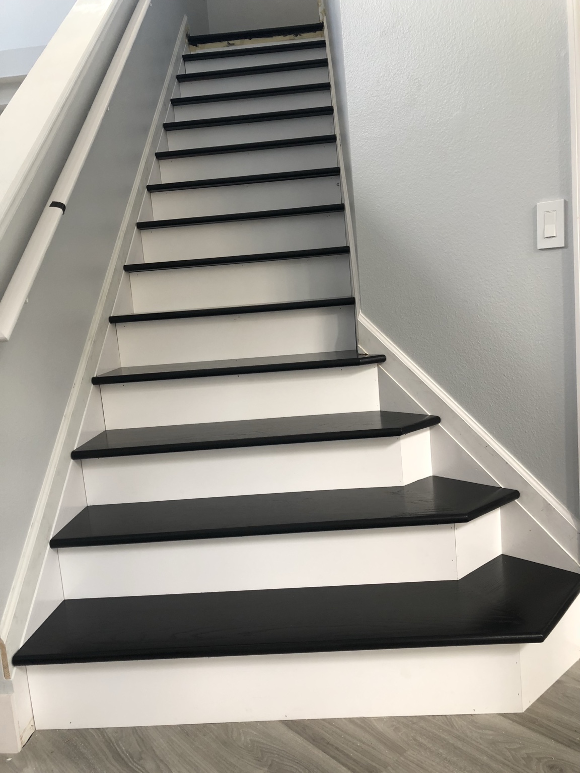 Front view of black and white staircase finishes