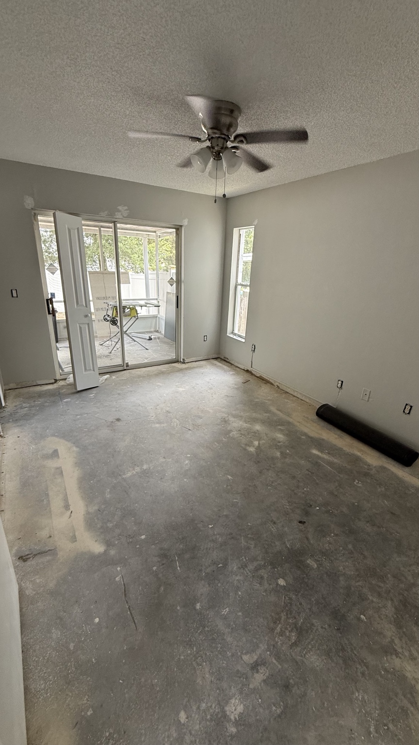 Room with flooring removed and surface preparation in progress