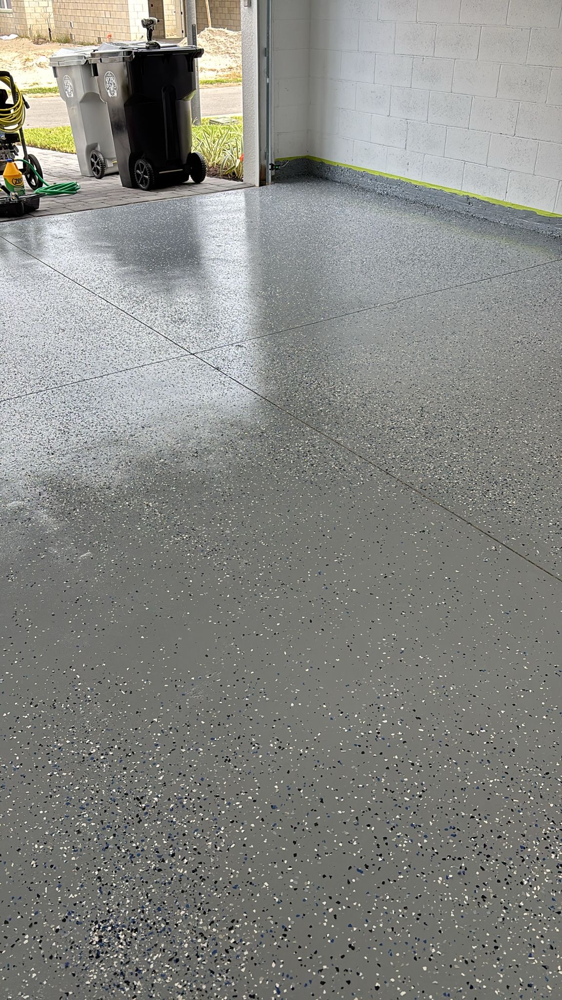 Epoxy garage floor application in progress